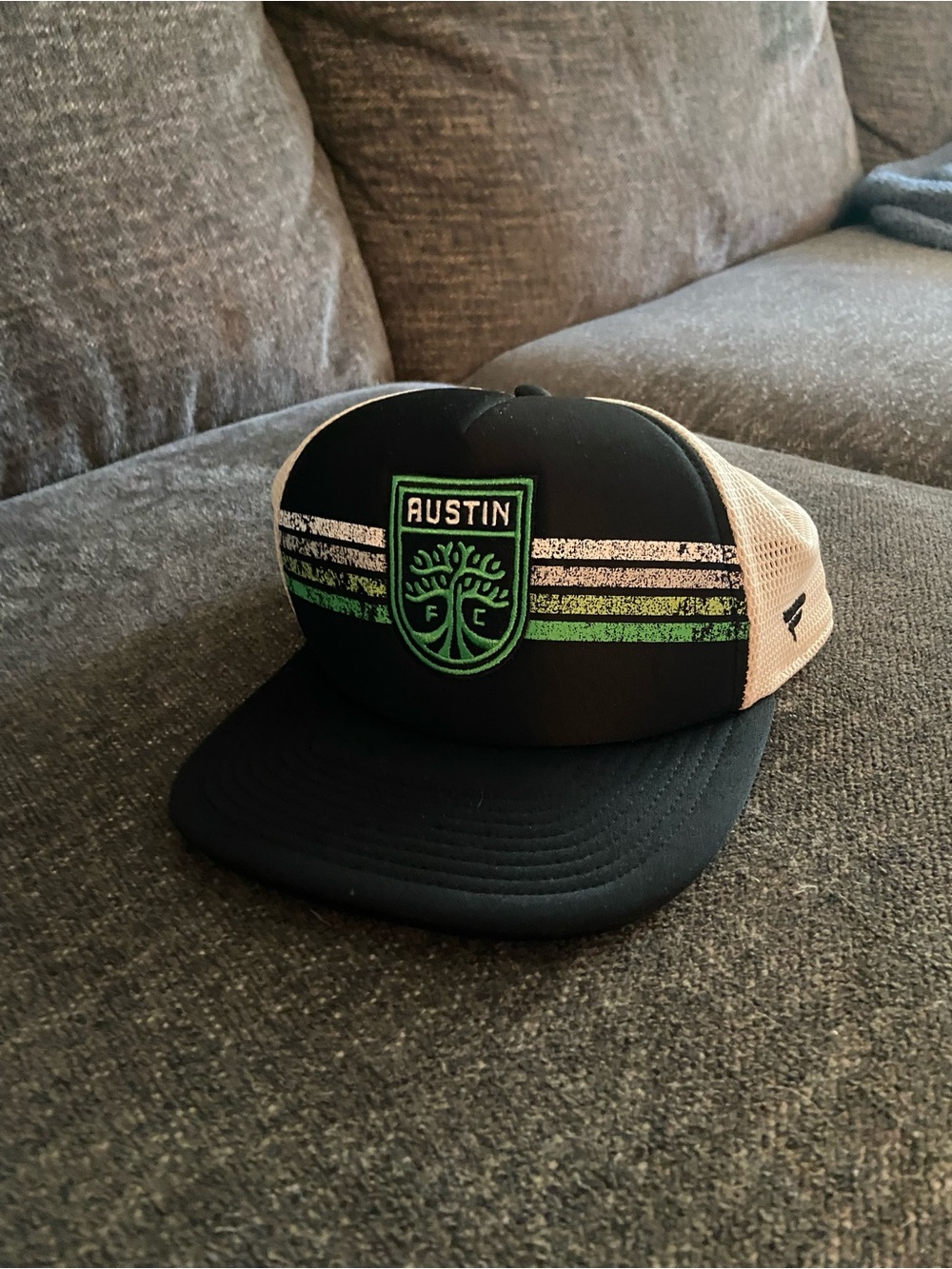 Fanatics Austin Black and Green Trucker Hat with Cream Mesh